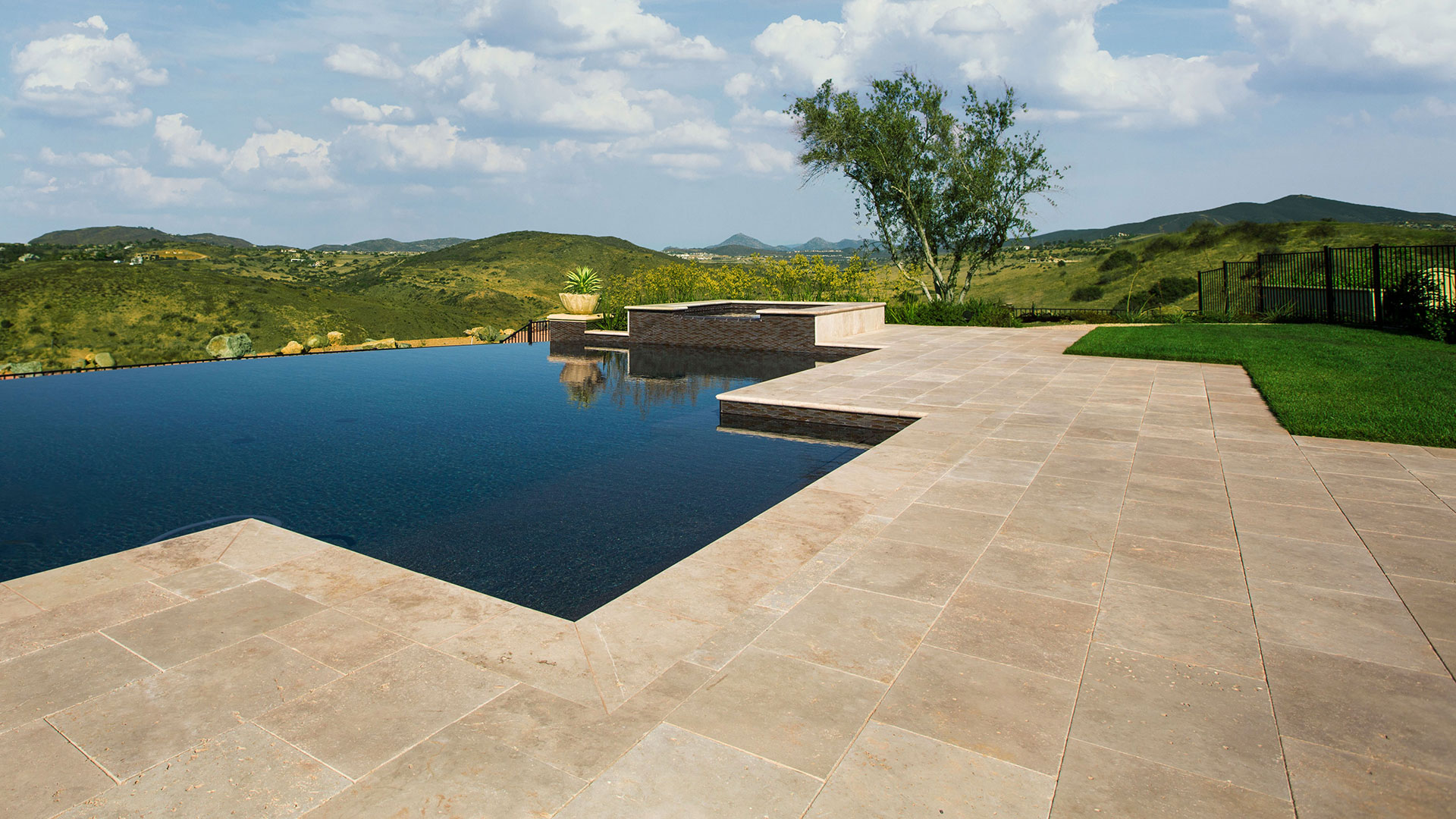 pool deck installed with kalahari travertine natural stone