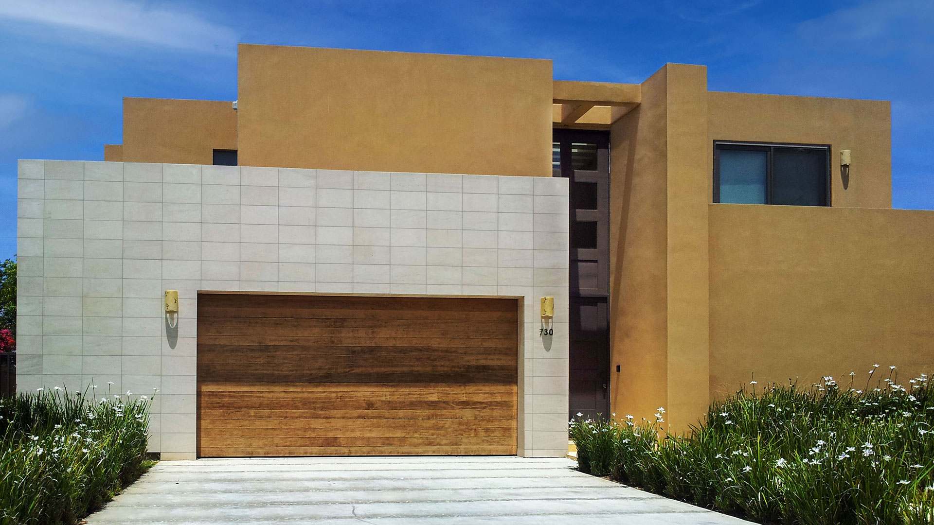 Nadia Neo Planks natural stone thin veneer installed on exterior wall of home around garage