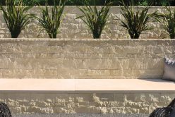 nadia pillowed thin veneer retaining wall with regent buff architectural cut stone seat