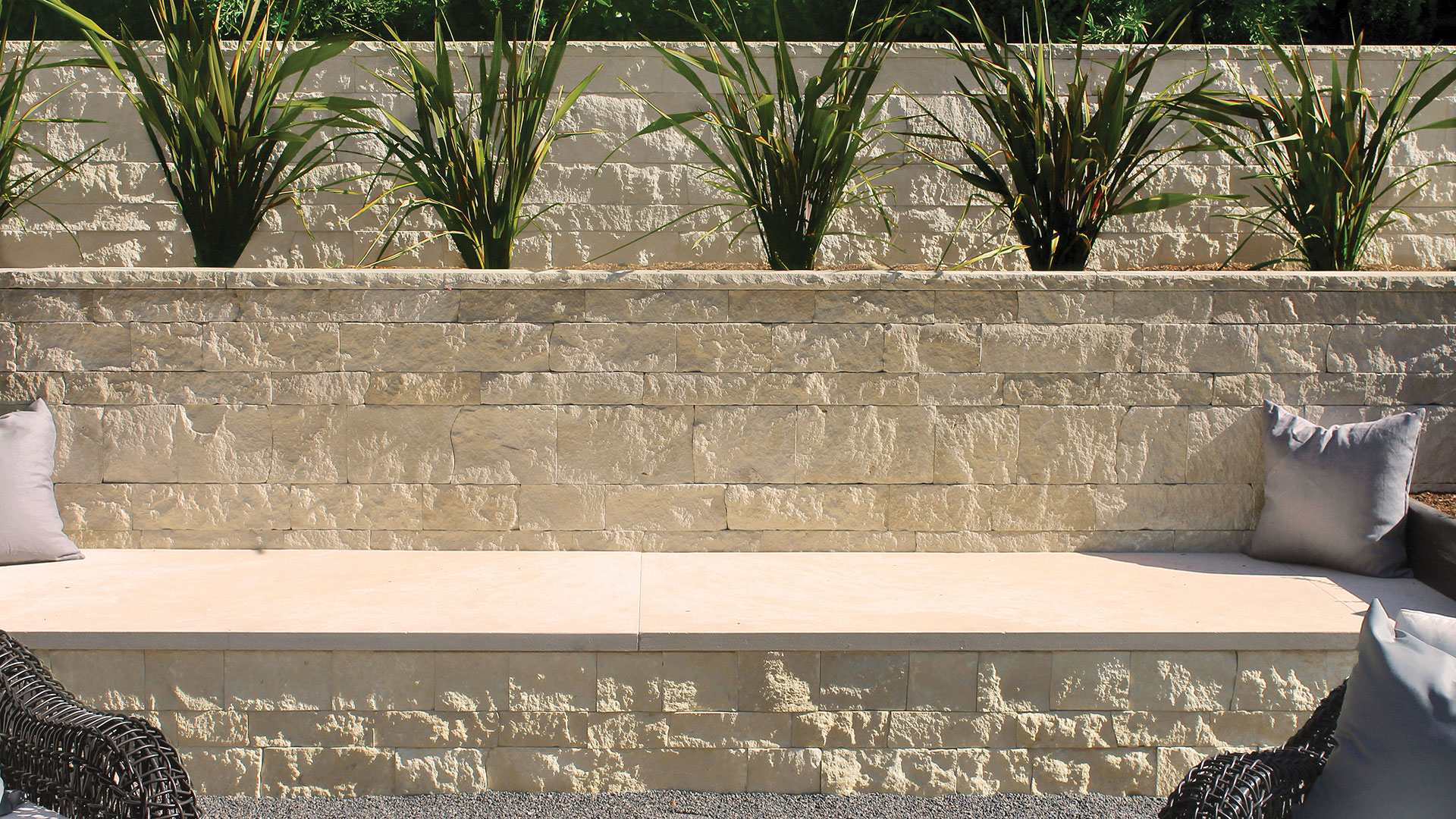 nadia pillowed thin veneer retaining wall with regent buff architectural cut stone seat