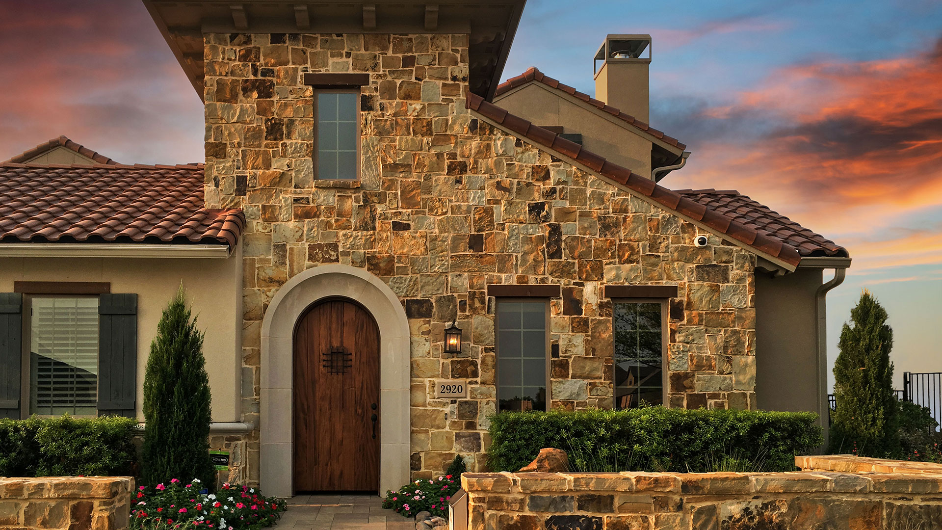 Ashwood Rubble natural stone thin veneer installed on exterior walls of a home