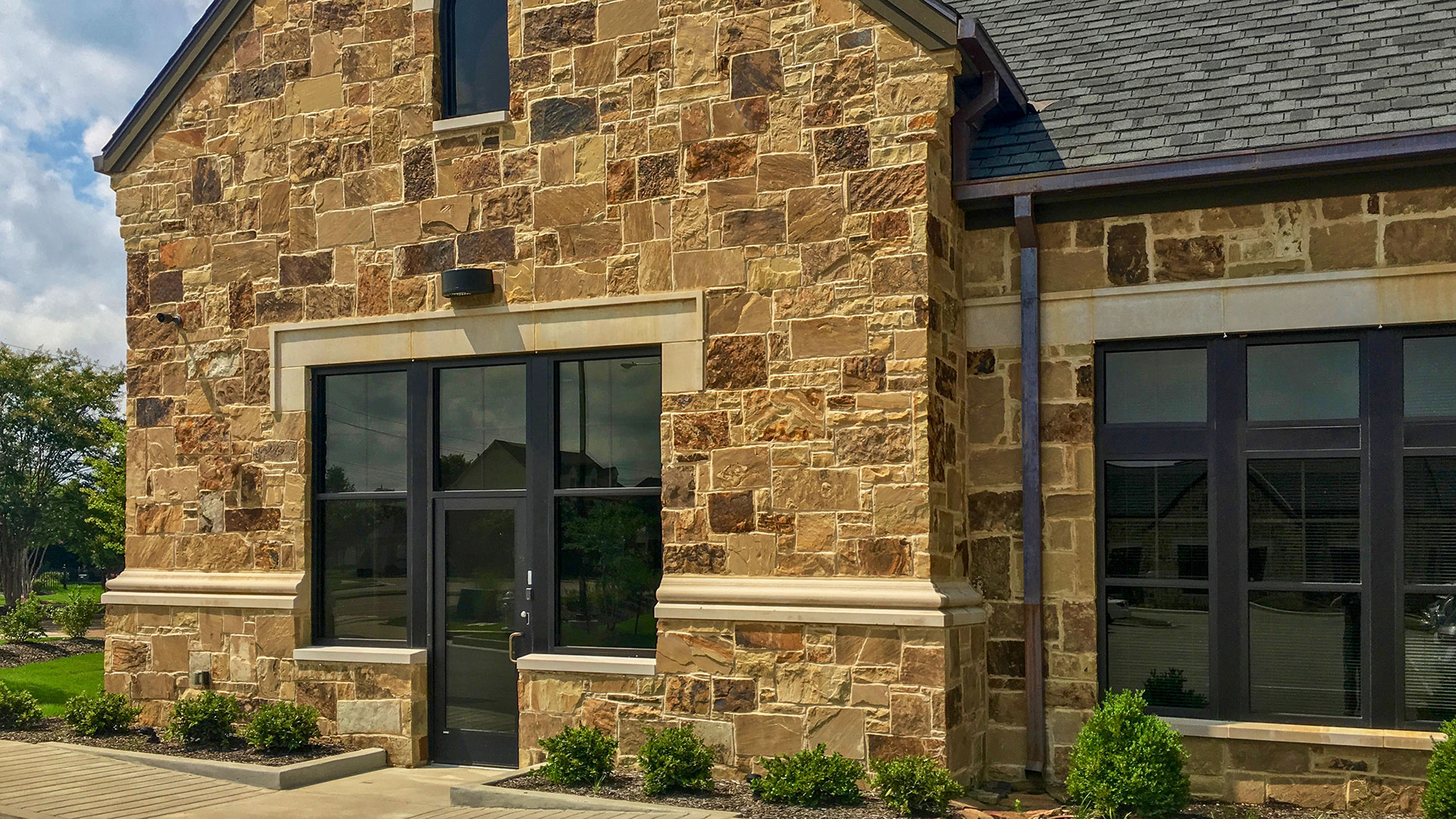 Ashwood Rubble natural stone thin veneer installed on exterior of an office building