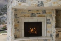 Cottage Cream Rubble natural stone thin veneer installed on exterior fireplace