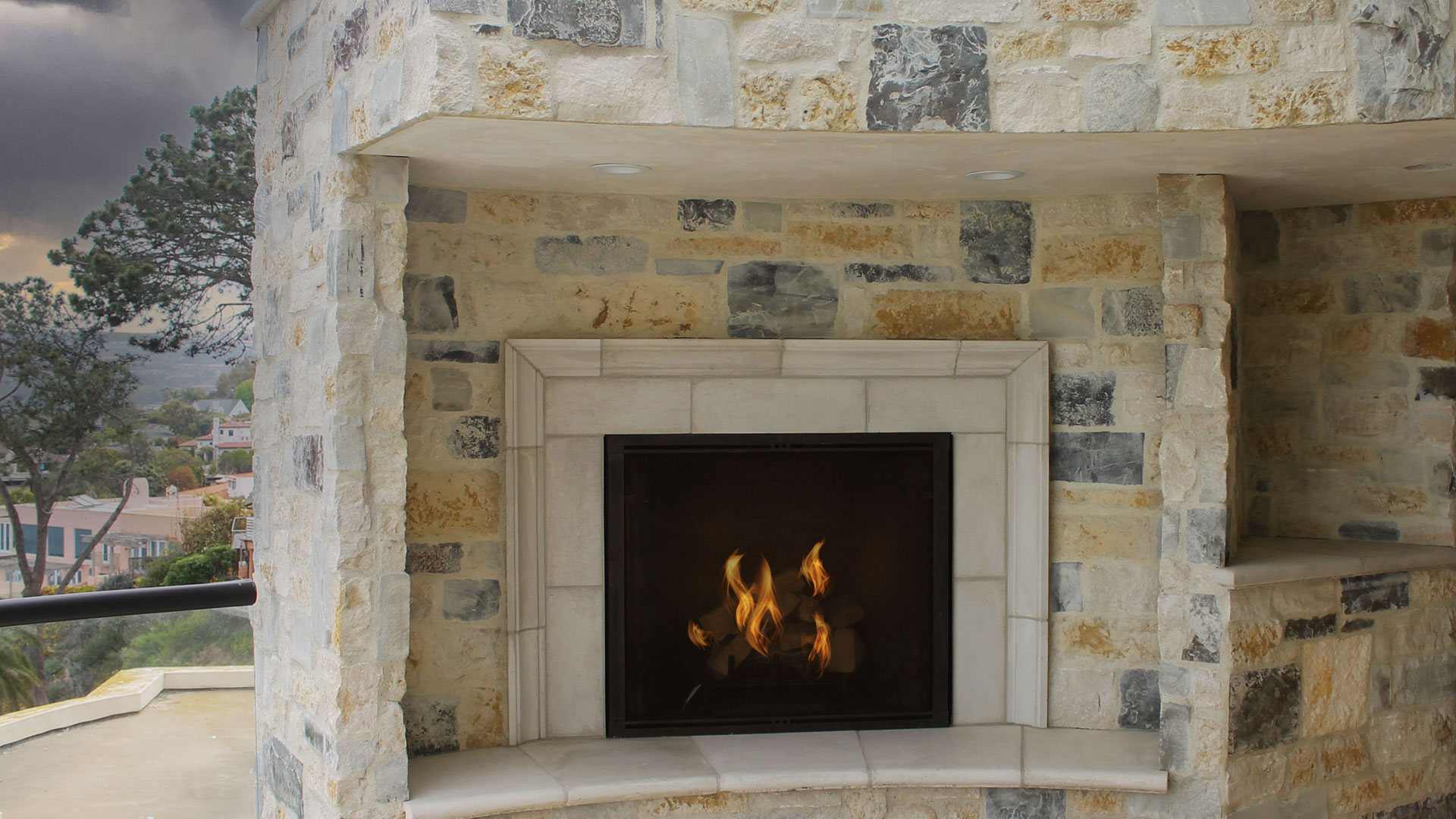 Cottage Cream Rubble natural stone thin veneer installed on exterior fireplace