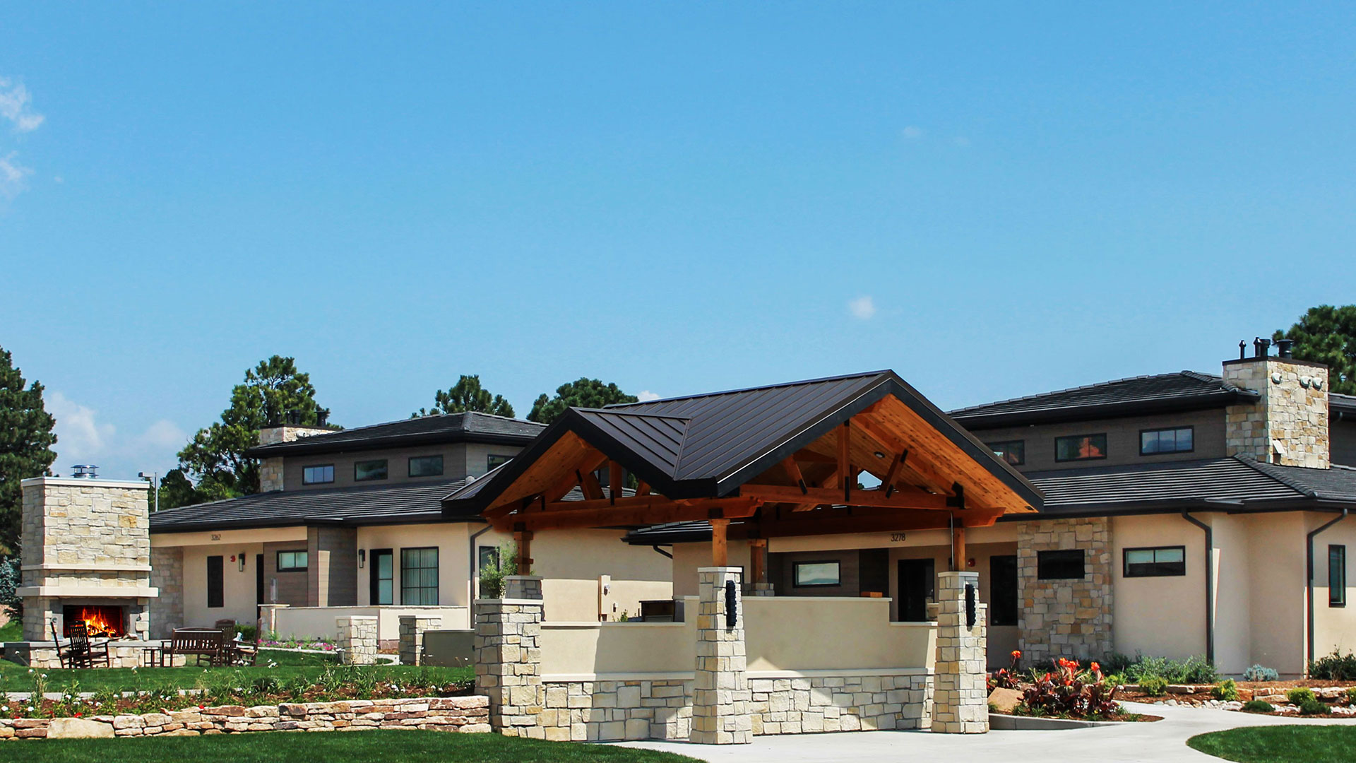 Multi-family residential buildings installed with Regent Buff Rubble thin veneer on exterior walls and fireplace