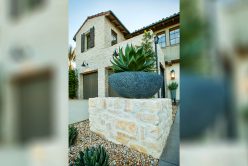 Rhinestone Rubble thin veneer installed on exterior walls and retaining walls with planted succulents
