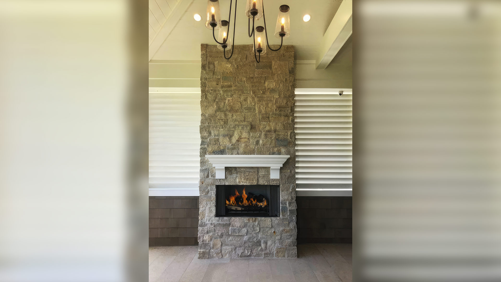 Tundra Cream Rubble natural stone thin veneer installed on custom fireplace.