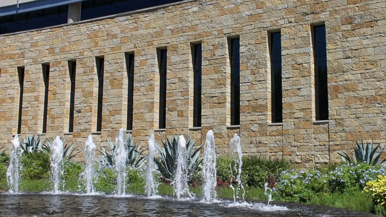 front of commercial building with archaic traditional thin veneer installed on exterior walls