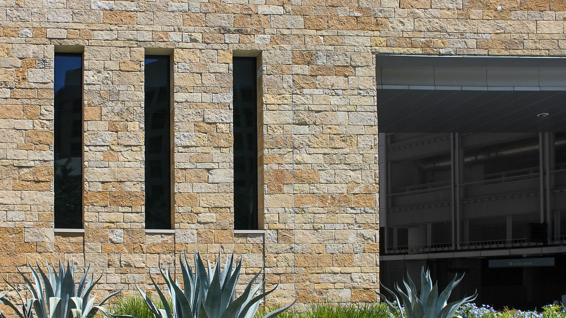 front of commercial building with archaic traditional thin veneer installed on exterior walls