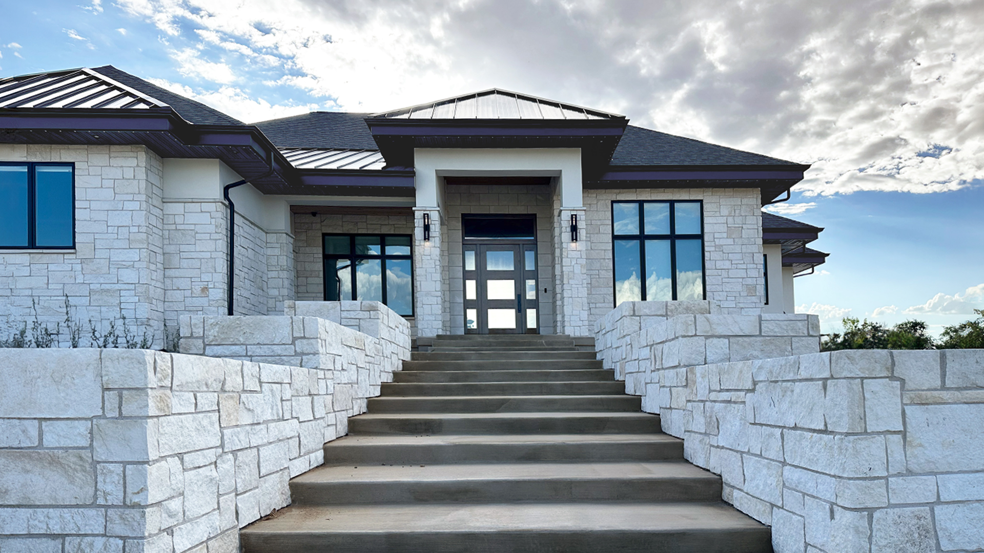 Blanco Traditional natural stone thin veneer installed on exterior of home.