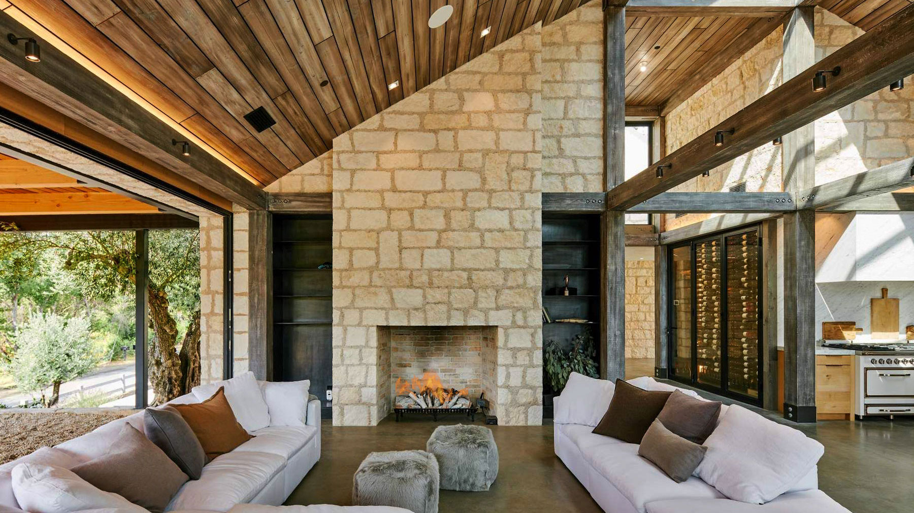 living room with fireplace with cream traditional natural stone thin veneer