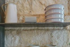 floating shelfs on interior kitchen wall installed with cream traditional thin veneer