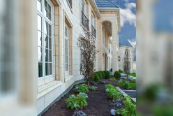 Cream custom architectural cut stone installed on exterior of custom built home