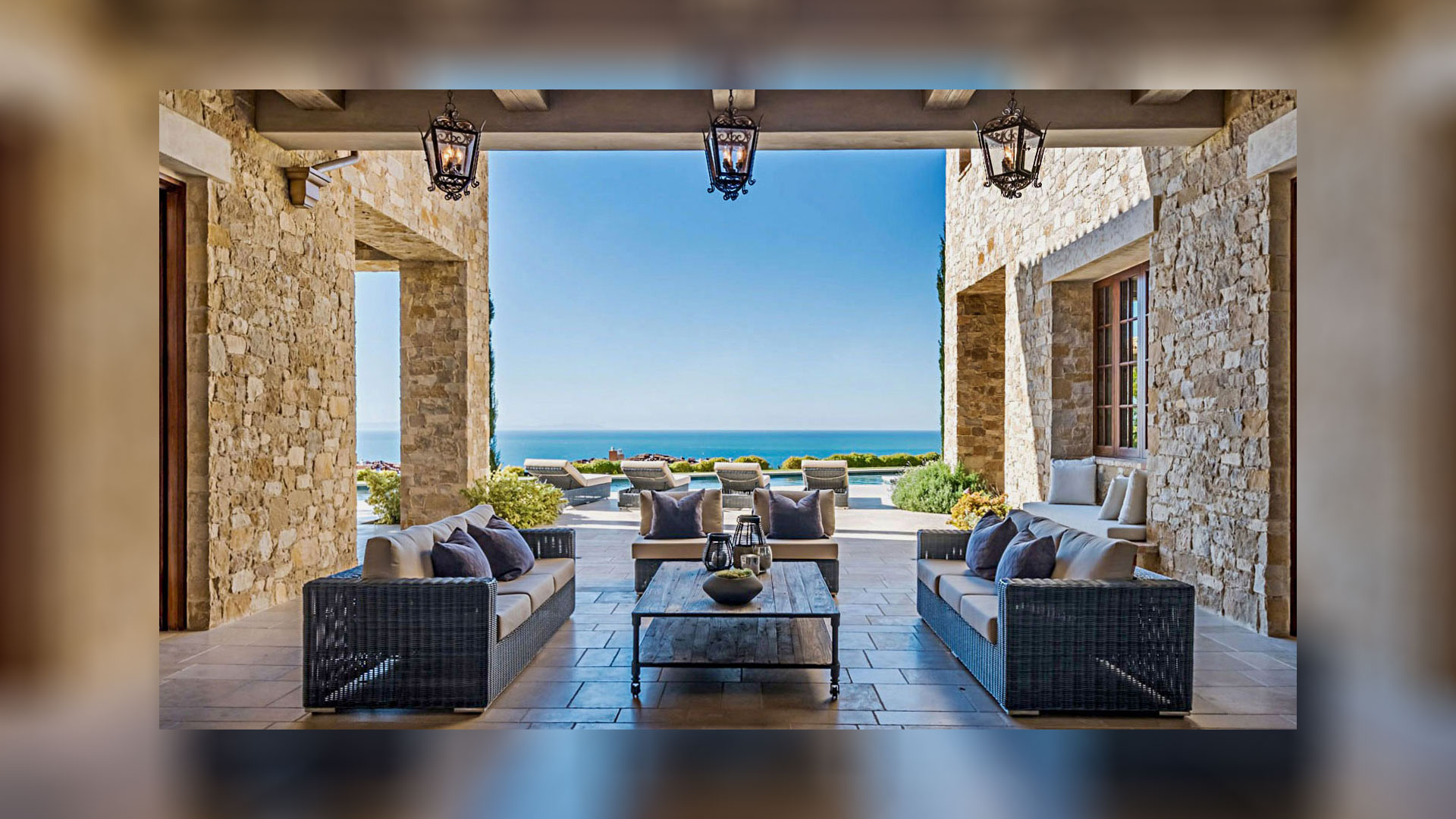 exterior seating area with ocean view Tuscan Blend Rubble thin veneer installed on exterior walls
