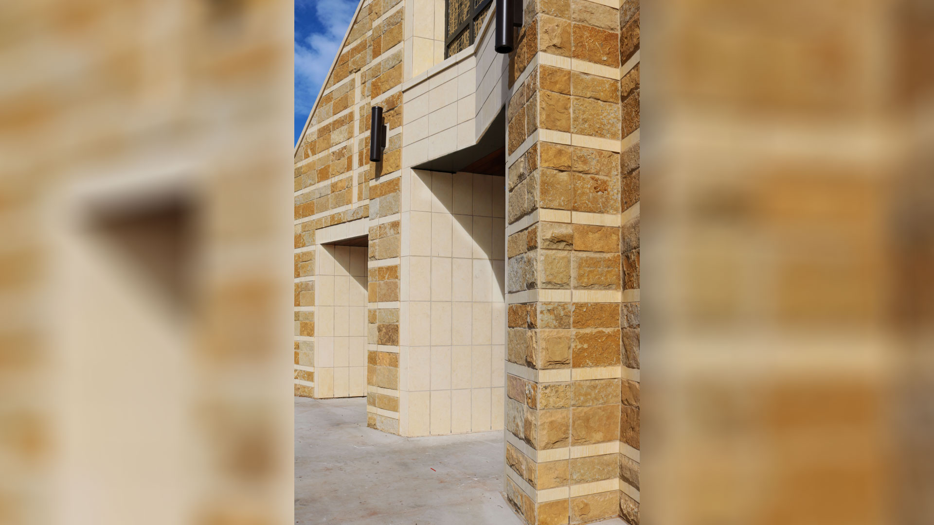cream custom architectural cut stone installed on exterior of church
