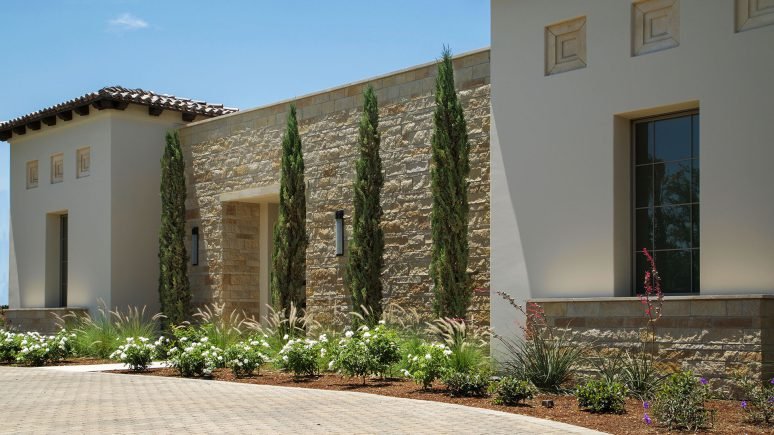 front of home with dark antique traditional natural stone thin veneer installed on exterior of home