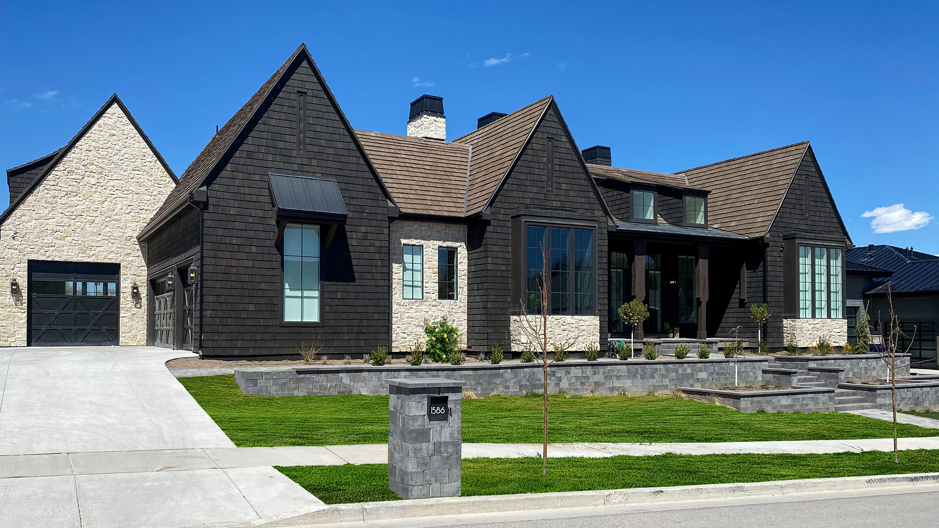 Tundra Cream Rubble natural stone thin veneer installed on exterior of custom home.