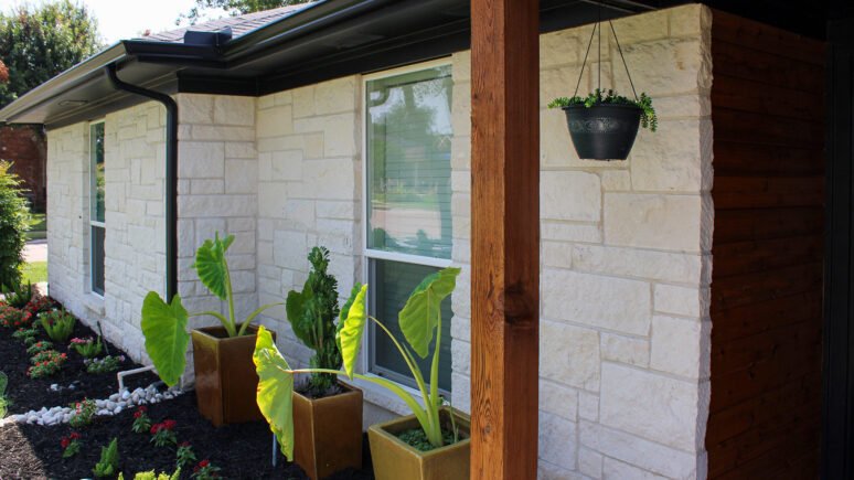 Blanco Traditional natural stone thin veneer installed on exterior of home.