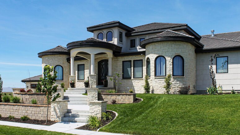 Cream Traditional natural stone thin veneer installed on custom home.