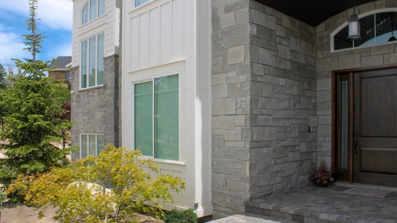 Mission Blue Traditional natural stone thin veneer installed on exterior of custom home.
