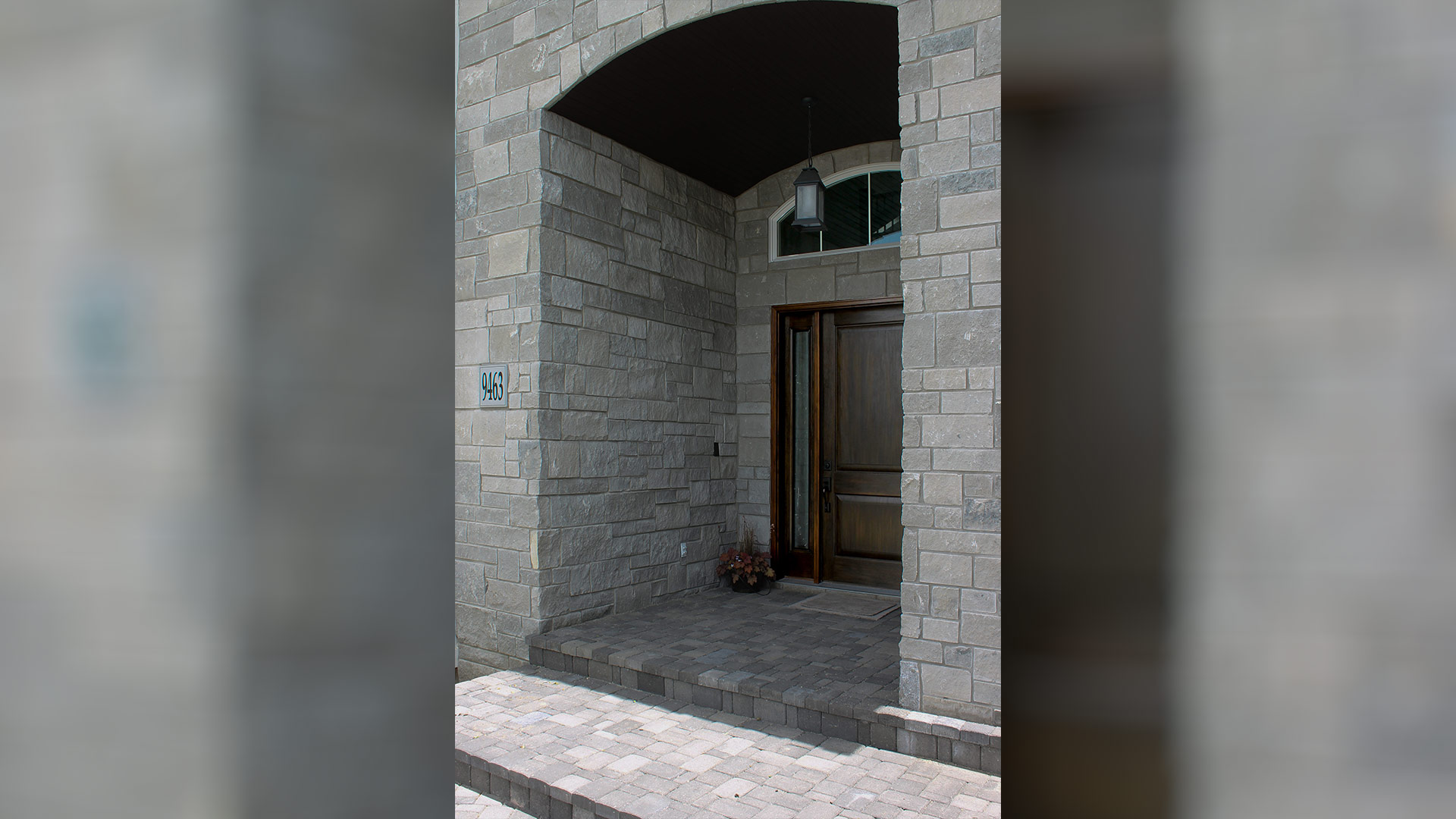Mission Blue Traditional natural stone thin veneer installed on exterior of custom home.