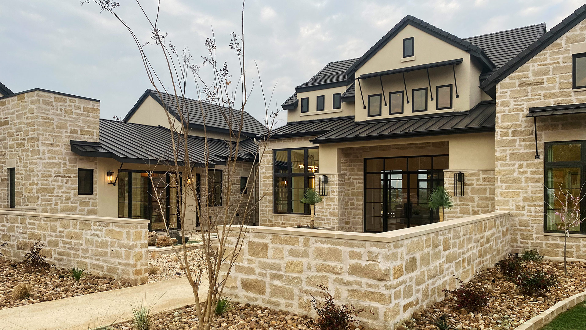 Regent Buff Traditional natural stone thin veneer installed on the exterior of a custom home.