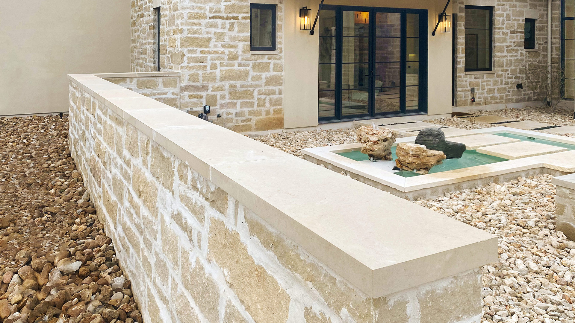 Regent Buff Traditional natural stone thin veneer installed on the exterior of a custom home.